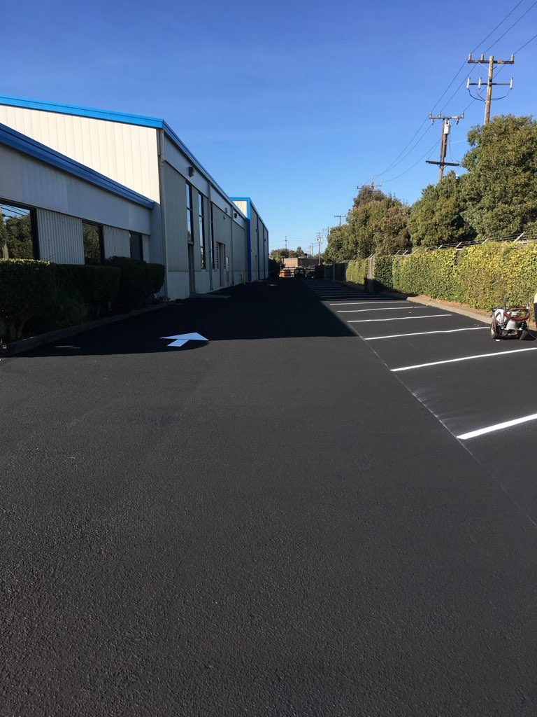 Parking lot sealcoating and striping